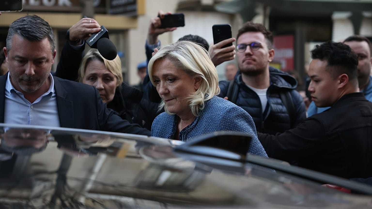 Marine Le Pen leaves the National Rally headquarters in Paris after a French court convicted her of embezzlement, 31 March, 2025