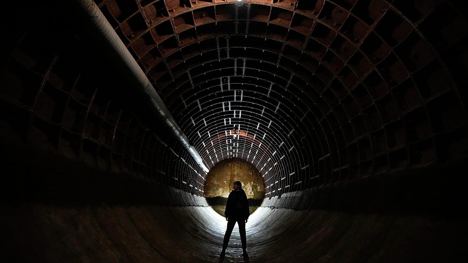 A woman tours Bunker-703, a recently declassified nuclear-resistant bomb shelter built in 1961, in Moscow, 22 December, 2024