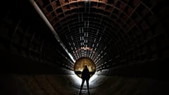 A woman tours Bunker-703, a recently declassified nuclear-resistant bomb shelter built in 1961, in Moscow, 22 December, 2024