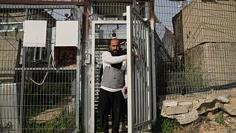 Hamdan Ballal, Oscar-winning Palestinian director of "No Other Land," is released from a police station after being detained by the Israeli army.