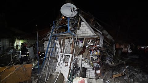 Rescue workers clear the rubble of a house destroyed in a Russian strike on a residential neighborhood of Kharkiv, Ukraine, Saturday, March 29, 2025. 