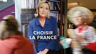 FILE: Two women pass an election poster for French far-right leader and presidential candidate Marine Le Pen which reads "Choose France" in Nice, 27 April 2017.