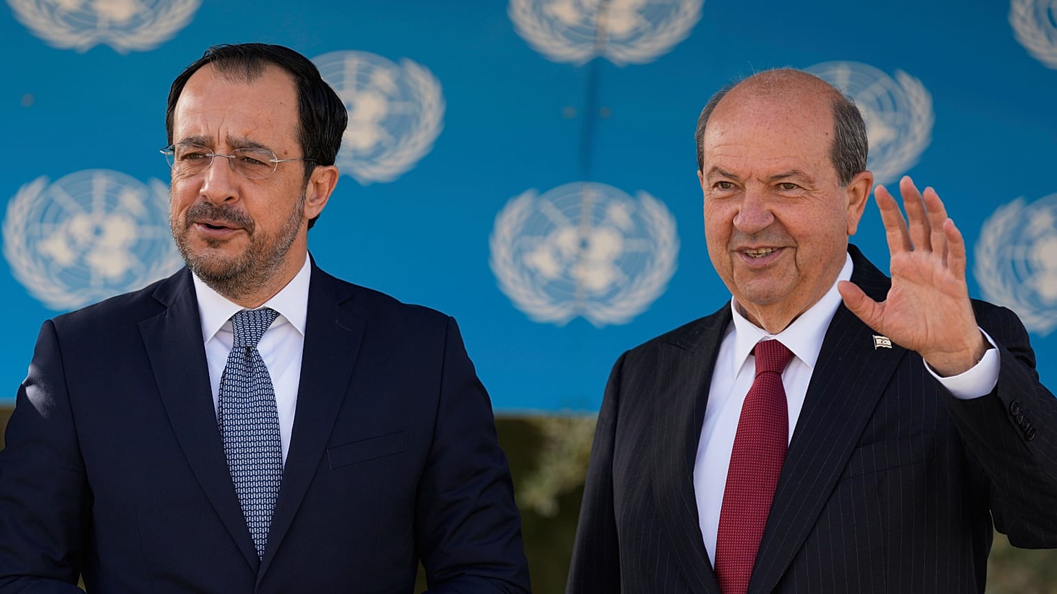 Cyprus' President Nikos Christodoulides, left, and Turkish Cypriot leader Ersin Tatar pose before talks in Nicosia, 2 April, 2025