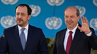 Cyprus' President Nikos Christodoulides, left, and Turkish Cypriot leader Ersin Tatar pose before talks in Nicosia, 2 April, 2025