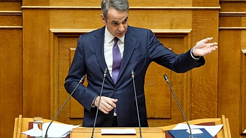 Greece's Prime Minister Kyriakos Mitsotakis speaks during a presentation of military spending plans, at the Greek Parliament, in Athens, Wednesday, April 2, 2025. 