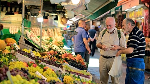 A man shops in a market in Istanbul, Monday, Aug. 13, 2018. 