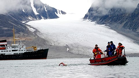 FILE - British long distance swimmer Lewis Gordon Pugh in action in the cold water off the arctic archipelogo Svalbard, Friday, Aug. 19, 2005. 