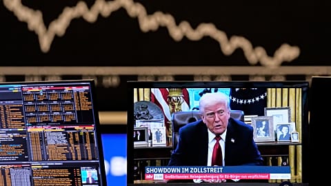 Us President Donald Trump appears on a television screen at the stock market in Frankfurt, Germany, Wednesday, April 2, 2025.