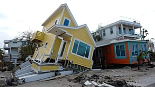 A house lies toppled off its stilts after the passage of Hurricane Milton, in Bradenton Beach on Anna Maria Island, Florida, 10 October, 2024.