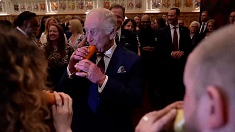 King Charles plays recorder made out of carrot