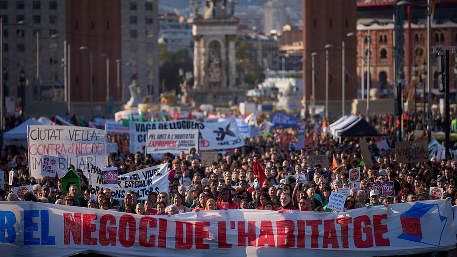 People gather during a demonstration to protest high housing costs in Barcelona, Spain, Saturday, April 5, 2025.