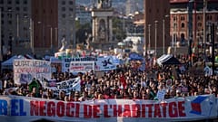 People gather during a demonstration to protest high housing costs in Barcelona, Spain, Saturday, April 5, 2025.
