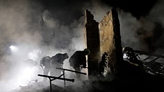 Firefighters put out a fire following a Russian drone attack on Kharkiv, 3 April, 2025 