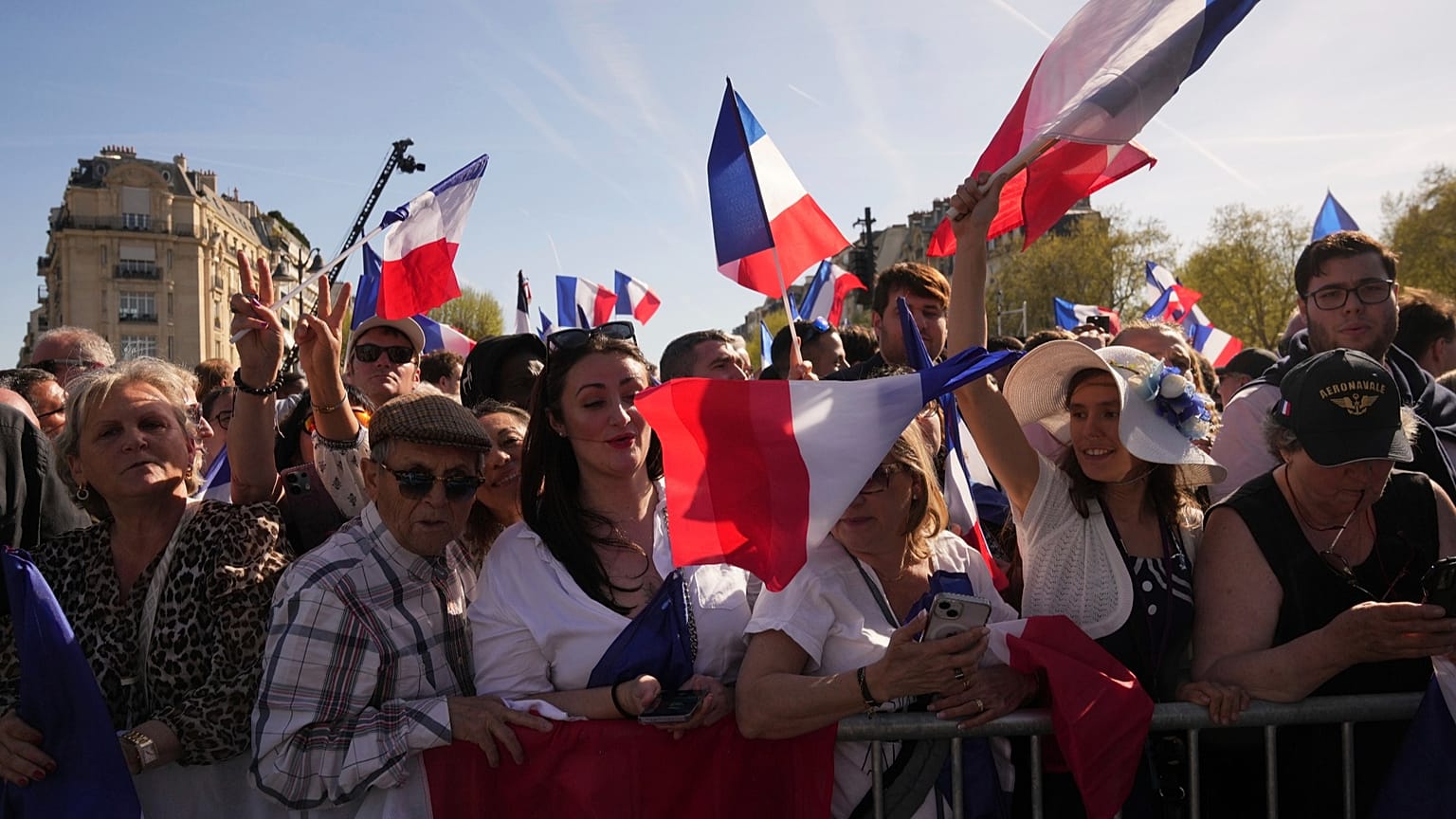People attend at the French far-right party national rally in support of Marine Le Pen near the parliament in Paris, 6 April 2025