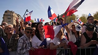 People attend at the French far-right party national rally in support of Marine Le Pen near the parliament in Paris, 6 April 2025