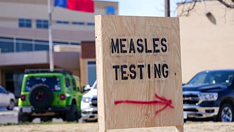A sign is seen outside of a medical clinic offering measles testing, Feb. 21, 2025, in the US state of Texas.