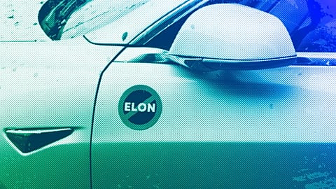 A Tesla vehicle displays an anti-Elon Musk sign near a protest against Tesla and Elon Musk outside a service centre in Seattle, March 2025