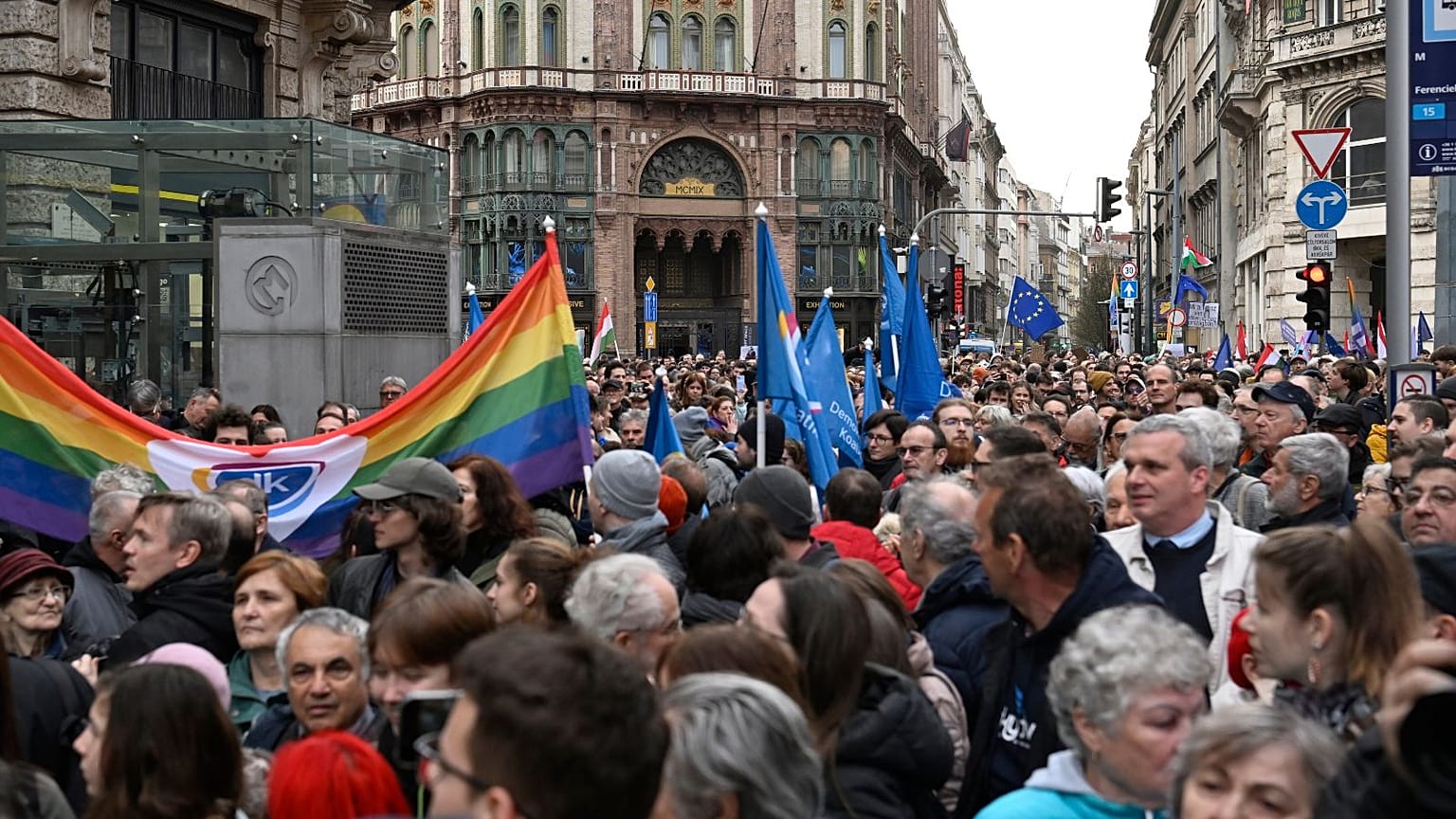 Demonstrators in Budapest protest against a law that effectively bans LGBTQ+ Pride events.