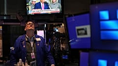 resident Donald Trump is displayed on a television on the floor at the New York Stock Exchange in New York, Tuesday, April 8, 2025.