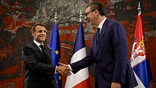 FILE - French President Emmanuel Macron, left, shakes hands with Serbian President Aleksandar Vucic in Belgrade, Serbia, Thursday, Aug. 29, 2024. 