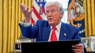 US President Donald Trump speaks as he signs executive orders in the Oval Office of the White House, 9 April 2025