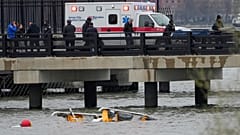 Emergency personnel work at the site of a helicopter crash on the Hudson River, Thursday, April 10, 2025, in Jersey City, N.J.