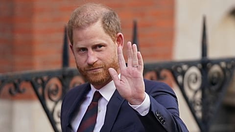 Prince Harry waves as he leaves the Royal Courts of Justice in London, Wednesday, April 9, 2025.