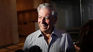 FILE - Writer Mario Vargas Llosa speaks to reporters in New York, 7 October 2010