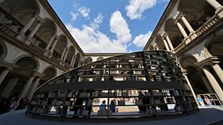 People visit " Library of Light" installation by Britain's Es Devlin, as part of the Design Fair exhibition, in Milan, Italy, Monday, 7 April 2025.