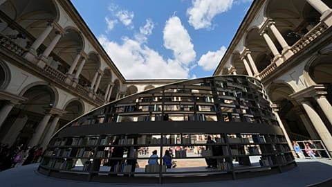 People visit " Library of Light" installation by Britain's Es Devlin, as part of the Design Fair exhibition, in Milan, Italy, Monday, 7 April 2025. 