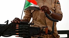 FILE: A Sudanese soldier from the Rapid Support Forces stands on his vehicle during a military-backed tribe's rally, in the East Nile province, Sudan, 22 June, 2019.