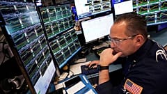 Specialist Anthony Matesic works at his post on the floor of the New York Stock Exchange, Friday, April 11, 2025.