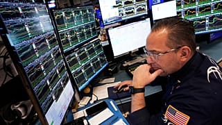 Specialist Anthony Matesic works at his post on the floor of the New York Stock Exchange, Friday, April 11, 2025.