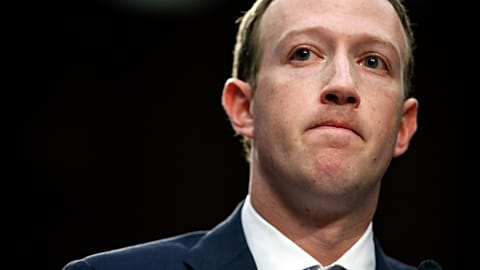 Facebook CEO Mark Zuckerberg pauses while speaking as he testifies before a joint hearing of the Commerce and Judiciary Committees on Capitol Hill in 2018