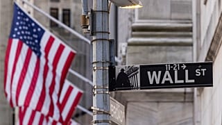 Wall Street sign is seen outside the New York Stock Exchange, Thursday, March. 21, 2024. Reddit shares will begin trading Thursday. 
