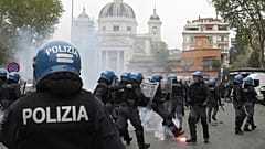 Lazio fans clash with policemen in riot gear outside the Olympic Stadium prior to the start of the Italian Serie A soccer match between Lazio and Roma in Rome, April 13, 2025