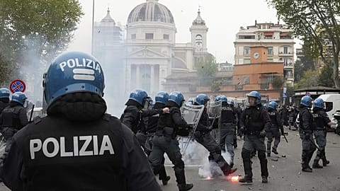 Lazio fans clash with policemen in riot gear outside the Olympic Stadium prior to the start of the Italian Serie A soccer match between Lazio and Roma in Rome, April 13, 2025