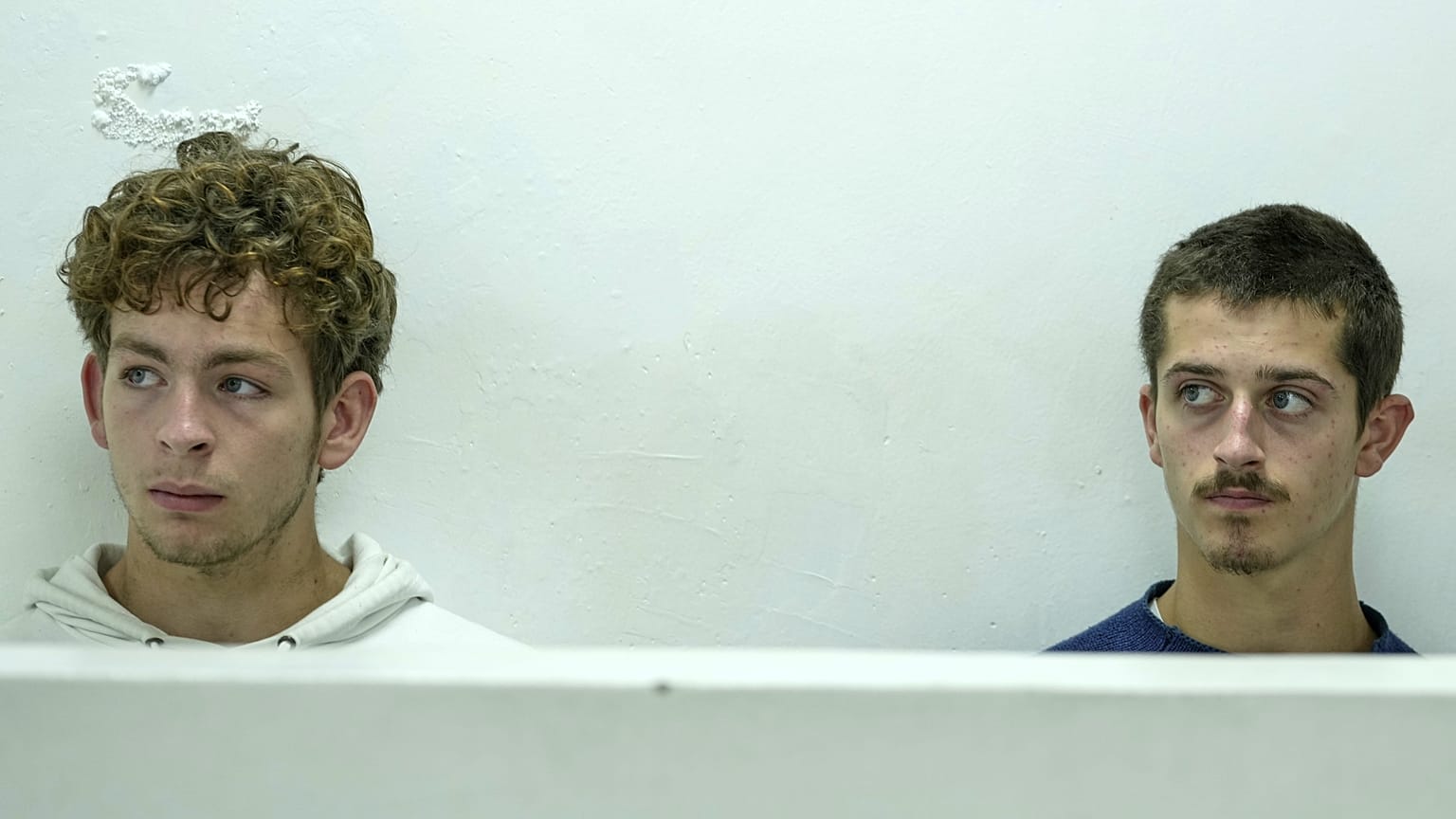 Belgian nationals Lornoy David, left, and Seppe Lodewijckx, right, at the Jomo Kenyatta International Airport Law Courts in Nairobi, 15 April, 2025