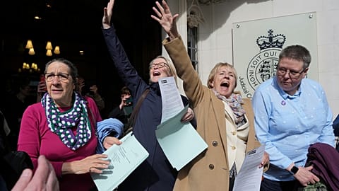 Activists celebrate outside the Supreme Court to challenge gender recognition laws, in London, 16 April 2025