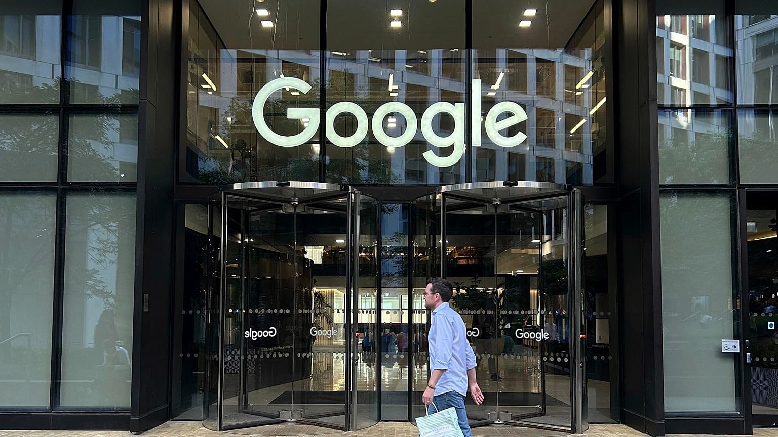 A man walks past Google's offices in London's Kings Cross area, on August 10, 2024.