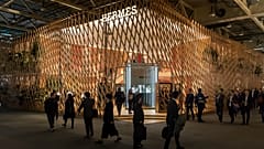 Visitors pass the Hermes booth at the world watch and jewellery show Baselworld in Basel, Switzerland, on Thursday, March 23, 2017. 