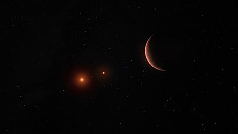 This artist’s illustration provided by the European Southern Observatory shows an exoplanet orbiting around two brown dwarfs, celestial objects that are lighter than stars. 