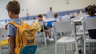 A pupil arrives at the J.H.Newman international school in Madrid, Spain, Tuesday, Sept. 8, 2020.