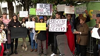 Protesters holding banners including "Don`t betray Montenegro", "Don`t betray Long Beach", "Investor = Devastater"