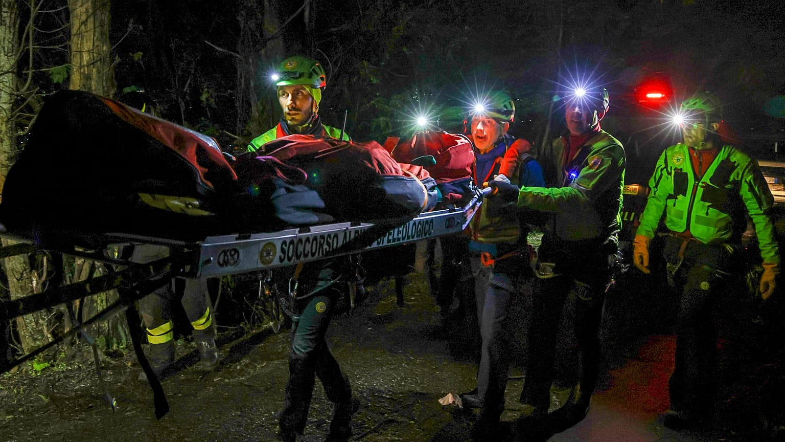 Rescuers recover the body of one of the victims of a cable car carrying tourists south of Naples which crashed after the cable snapped, 17 April, 2025