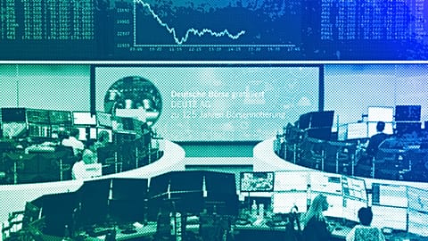 Stock market traders work behind their desks on the trading floor of the Frankfurt Stock Exchange, March 2025