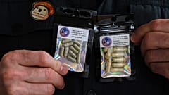 A US military veteran who grows his own mushrooms for microdosing psilocybin displays prepared doses in packets Wednesday, March 26, 2025.