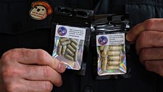A US military veteran who grows his own mushrooms for microdosing psilocybin displays prepared doses in packets Wednesday, March 26, 2025.
