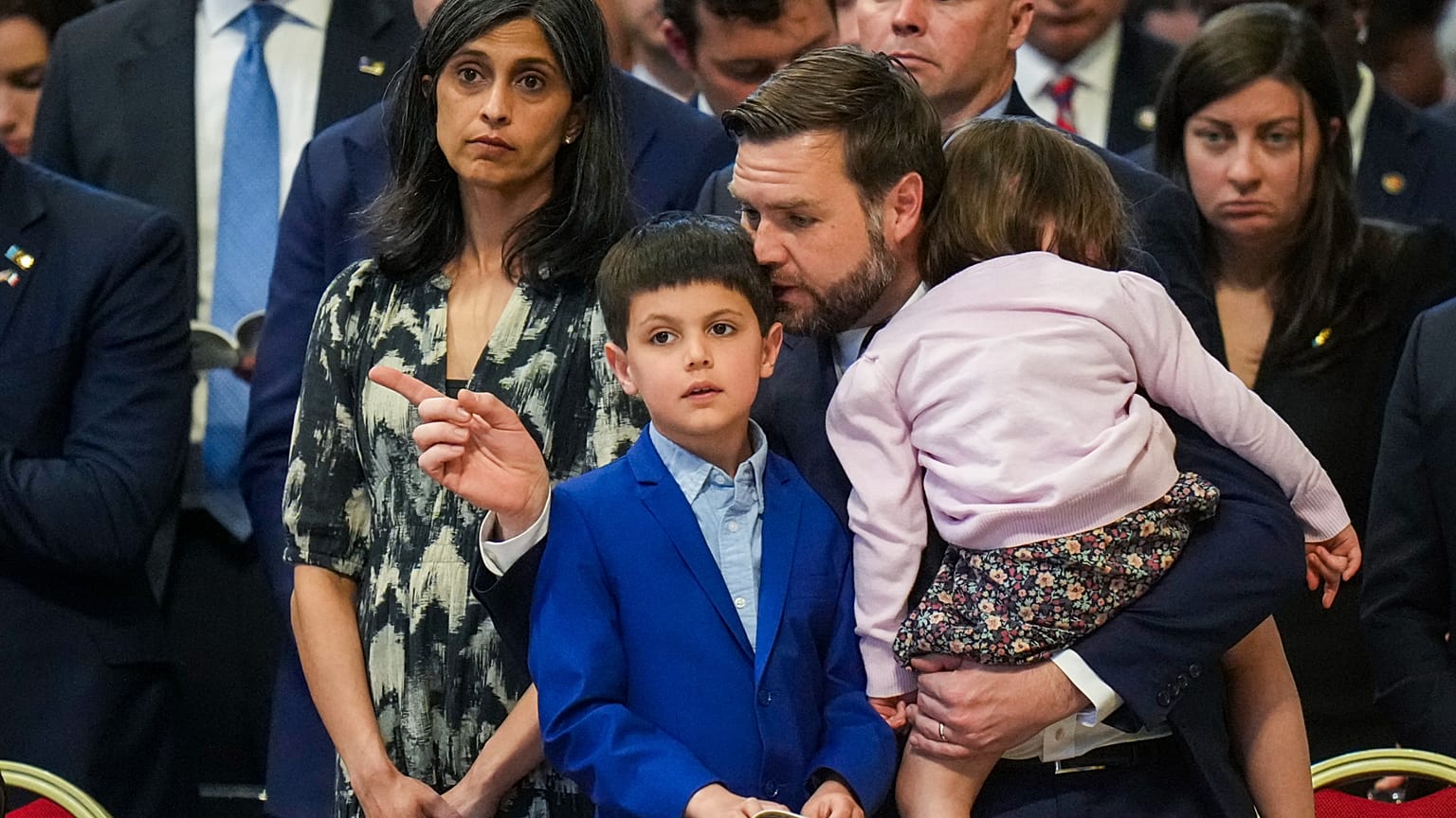 U.S. Vice President JD Vance, and his wife Usha Vance, left, with their daughter Mirabel, back to camera, and son Vivek attend a Good Friday service inside St. Peter's Basilic