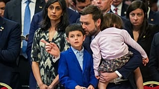 U.S. Vice President JD Vance, and his wife Usha Vance, left, with their daughter Mirabel, back to camera, and son Vivek attend a Good Friday service inside St. Peter's Basilic